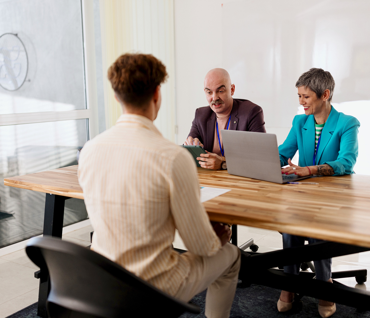 Job interview with three people at table.